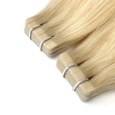 Le vrai ruban adhésif pour cheveux humains Remy dans les extensions capillaires pour une application sans tracas