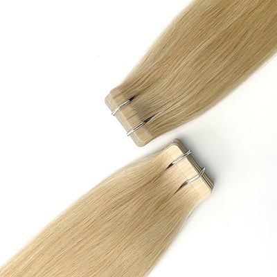 Le vrai ruban adhésif pour cheveux humains Remy dans les extensions capillaires pour une application sans tracas